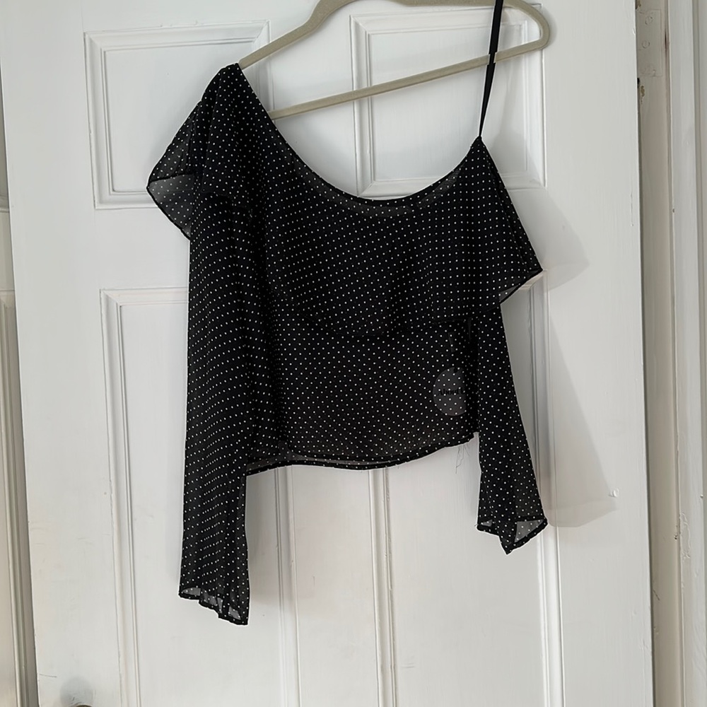 About is sheer poka dot top
